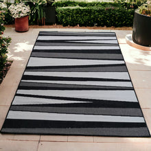 Load image into Gallery viewer, Black and Grey Reversible Striped Outdoor Rug - Capri